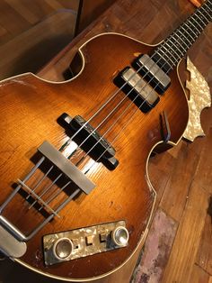 an electric guitar sitting on top of a wooden floor