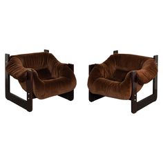 a pair of brown chairs sitting next to each other on top of a white background