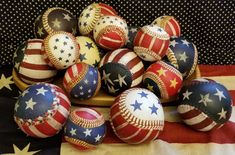 a pile of baseballs with stars and stripes on them