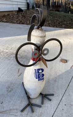 an old fire hydrant with scissors attached to it