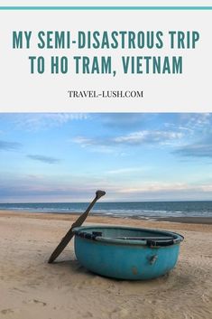 a blue boat on the beach with text overlay saying my semi - disastrous trip to ho tram, vietnam