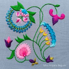 the embroidery work is colorful and has flowers on it
