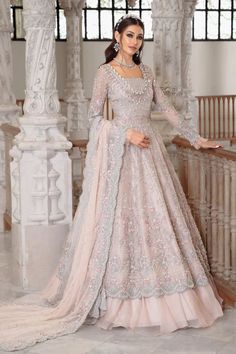 This luxurious long gown features a double beaded neckline and intricate hand detailing with pearls, diamonites, sequins, and 3D floral work. It has a scalloped worked border cascading over a tulle-based lehenga. The dupatta's head border is hand embellished, while the other three sides have an embroidered border with pearl-finished scalloped edges. Style: Long Gown with Lehnga Disclaimer: "Look of the dress may vary as per customer's height." Color: Pale Pink (Gown, Dupatta, Lehnga, Blouse) Fab Pastel, Couture, Asian Wedding Outfits, Pastel Pink Dress, Pakistani Bridal Dress, Walima Dress, Desi Wedding Dresses, Nikkah Dress, Desi Dresses