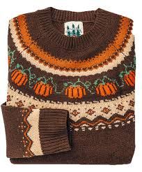 a brown sweater with pumpkins on it