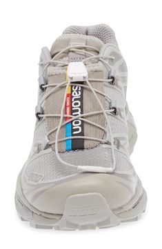 the shoe laces are attached to the side of a sneaker's shoe