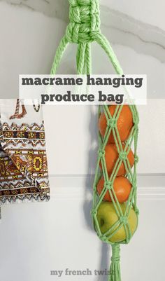 macrame hanging produce bag with apples and oranges