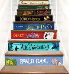 a set of stairs with books on the top and bottom, all in different colors