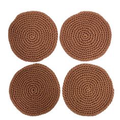 four round rugs are shown on a white background
