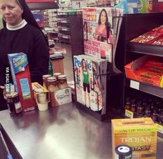 a man is standing at the cash register in a store