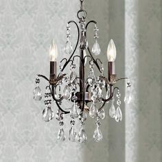 a chandelier with crystal drops hanging from it