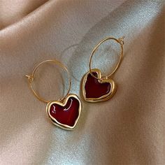 Due to the handmade nature of this earring there may be slight imperfections. Elevated Jewelry, Red Heart Earrings, Gelang Manik, Women Earrings, Heart Shaped Earrings, Metal Heart, Earrings Women, Winter Trends, Black Earrings