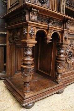 an old wooden desk with ornate carvings on it