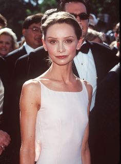 a woman in a white dress at an event