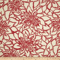 a piece of fabric with red flowers on it and a ruler in the foreground