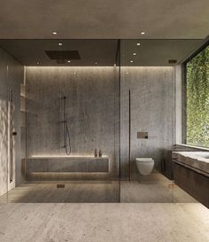 a bathroom with a large glass shower door