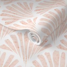 a pink and white wallpaper with large leaves on it