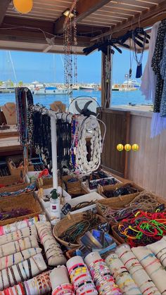 many bracelets and necklaces are on display at the boat's deck,