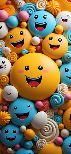 many different colored candies with smiling faces