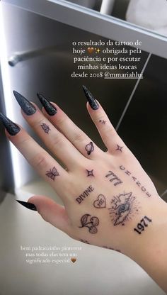 a woman's hand with tattoos on it and the words written in different languages