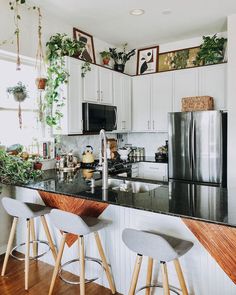 the kitchen is clean and ready for us to use it's counter tops are black