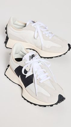 a pair of white and black sneakers