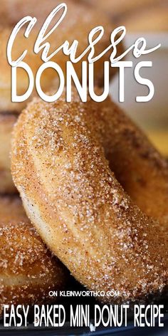 donuts with powdered sugar are stacked on top of each other