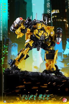 a yellow and black robot toy on top of a pile of rocks in front of a cityscape