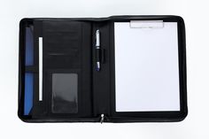 an open black leather case with notepad, pen and clipboard on white background