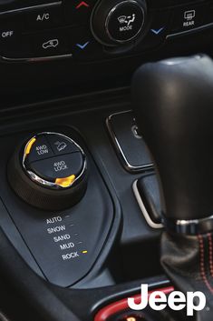 an automatic gear stick in the center console of a car