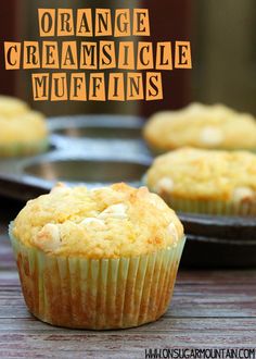 orange creamsicle muffins are sitting on a table