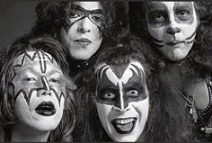 the kiss band members are posing for a photo with their faces painted black and white