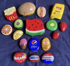 there are many different types of food on the bed together, including donuts, watermelon, mcdonald's and other foods