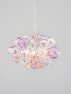 a chandelier made out of bubble balls hanging from the ceiling