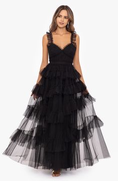 Look every part the princess in this tiered tulle gown that features ruffled flourishes, adjustable straps and a face-framing sweetheart neckline. 59" length (size 8) Hidden back-zip closure Sweetheart neck Adjustable straps Lined 100% polyester with 94% polyester, 6% spandex trim Dry clean Imported Black Ruffle Dress Long, Neutral Dresses, Big Closet, Dresses Flowy, Shimmery Dress, Satin Belt, Military Ball Dresses, Off Shoulder Dresses, Tiered Ruffle Skirt