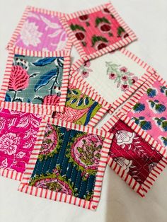 small patchwork squares are laid out on the table