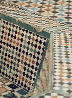 a close up of a tiled floor with an odd design