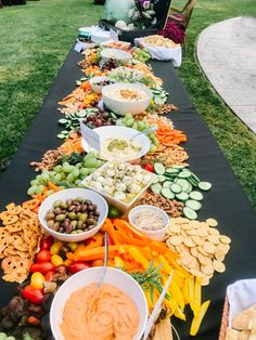 a long table filled with lots of different foods and dips on top of it