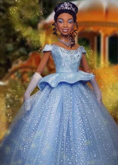 the doll is wearing a blue dress and tiara