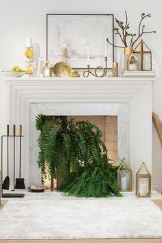 a living room filled with furniture and a fire place covered in greenery next to a fireplace