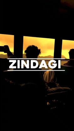 two people sitting in front of a window with the word zindagi on it