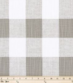 a gray and white checkered fabric with a ruler