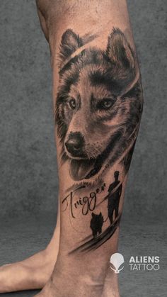 a man's leg with a bear tattoo on it