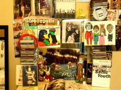 there are many different pictures on the wall in this room, including children's books and magazines