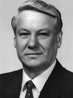 a man in a suit and tie is looking at the camera with an angry look on his face