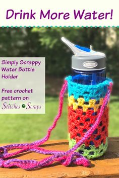 a colorful crocheted water bottle cover with the words drink more water on it