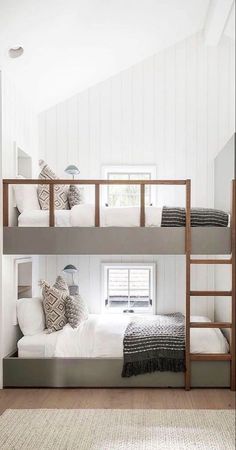a bedroom with bunk beds and white walls