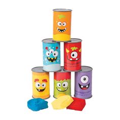 a stack of different colored cups with faces on them and sponges in the middle