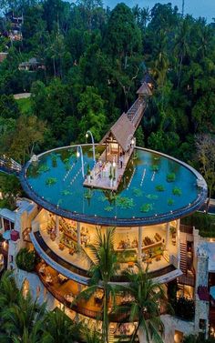 an aerial view of the pool and restaurant at night