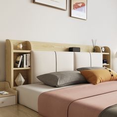 a bedroom with a bed, bookshelf and pictures on the wall above it