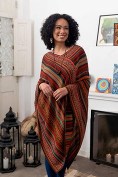 Alfredo Falcon of Peru designs this striped acrylic poncho with bold colors and a mixture of geometric motifs. A touch of baby alpaca gives adds to the poncho's warmth and feel. Lightweight the poncho makes a wonderful layering piece. Alfredo Falcon learned the craft of weaving from his parents who learned from their parents before them. He says âWe have been a family devoted to the world of textiles for generations. I use modern colors but I remain true to Incan and colonial motifs.â Ponchos, Poncho Outfit Winter, Earthy Girl, Knit Poncho Sweater, Patchwork Scarf, Wardrobe Goals, Boheme Chic, Alpaca Scarf, Fair Trade Clothing